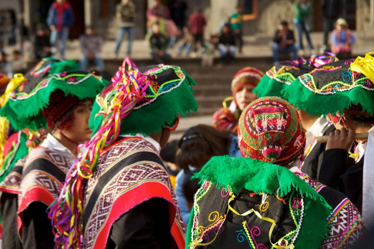Attendees in costume at a Peruvian festival