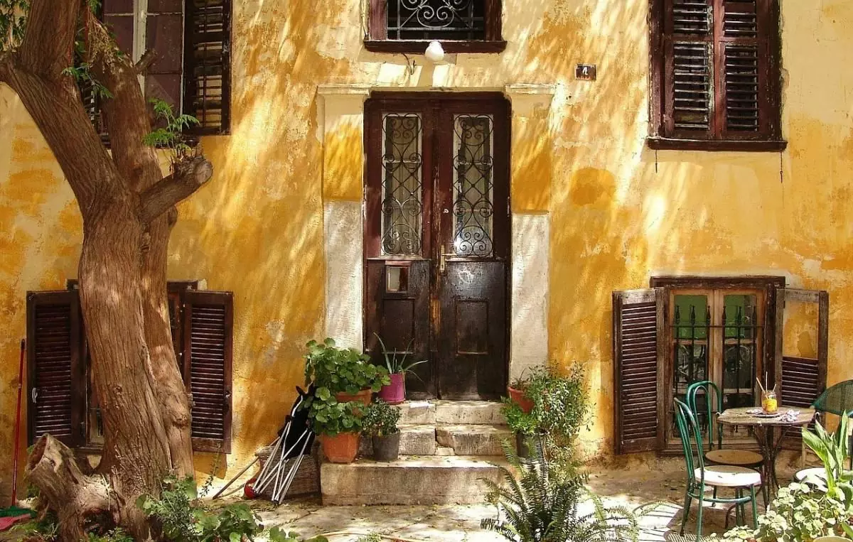 Facade of yellow house in Athens, Greece