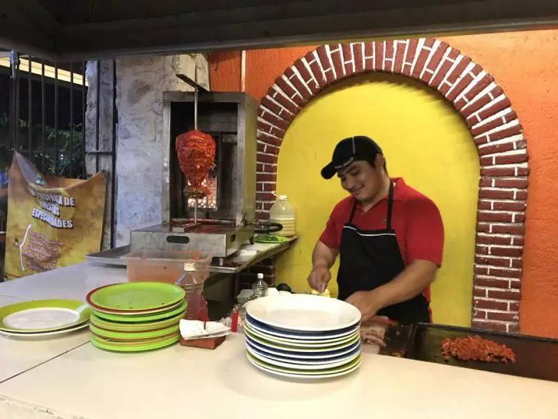 Preparing tacos in a local restaurant