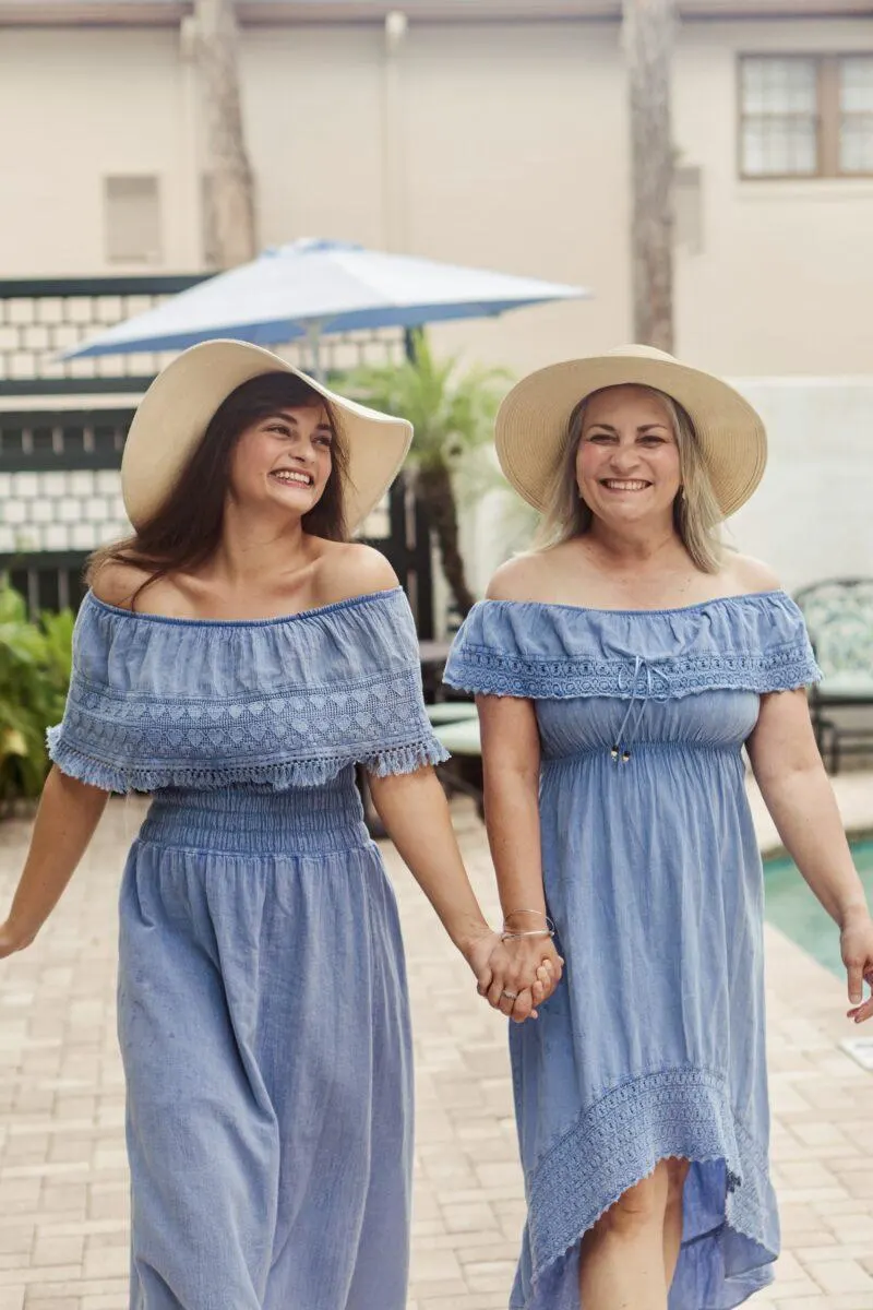 Mother and daughter holding hands