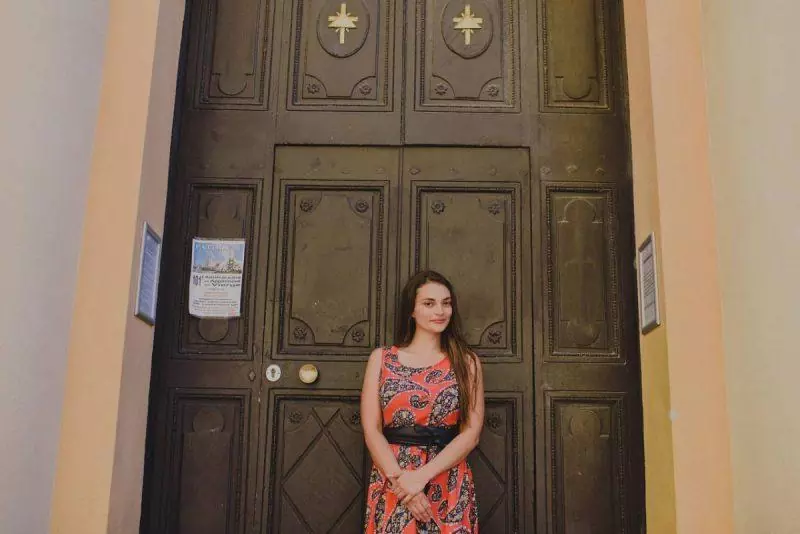 Posing in front of a church door