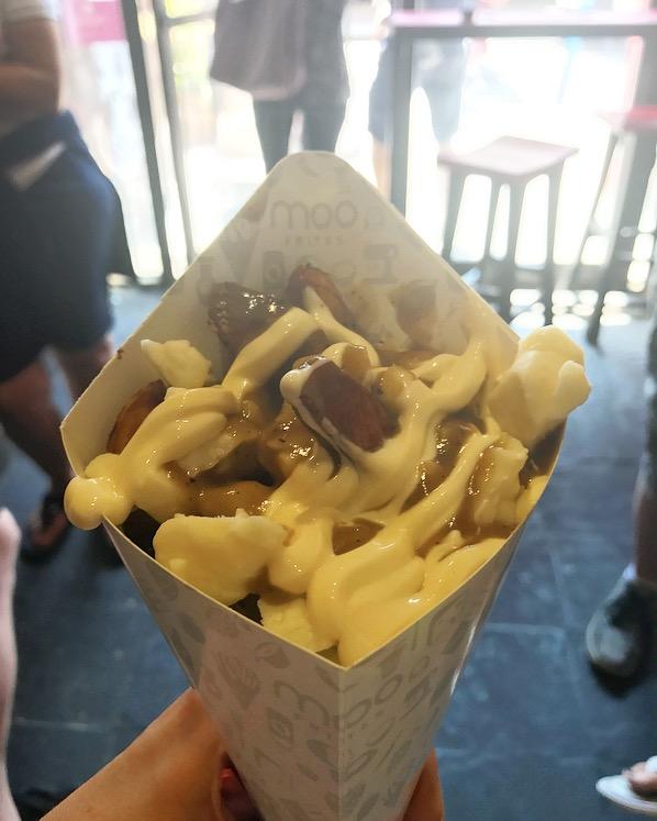 Poutines smothered in cheese