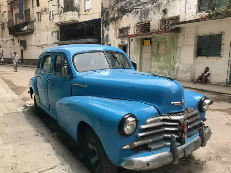 Blue classic car parked on the street