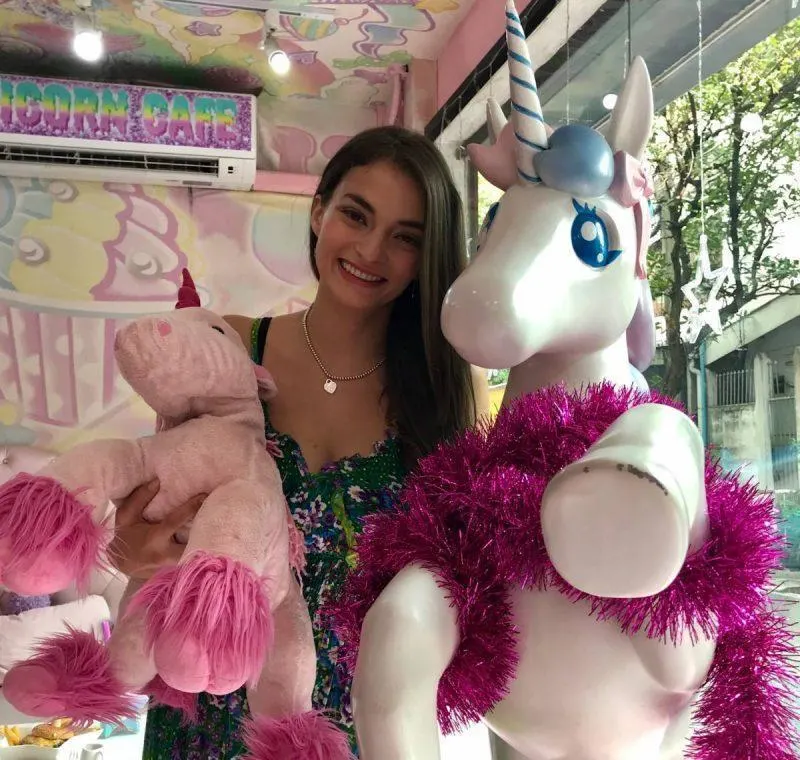 Posing with the unicorn at the entrance