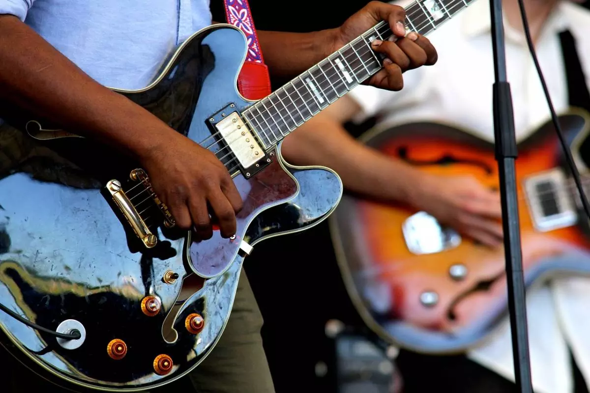 Men playing guitars