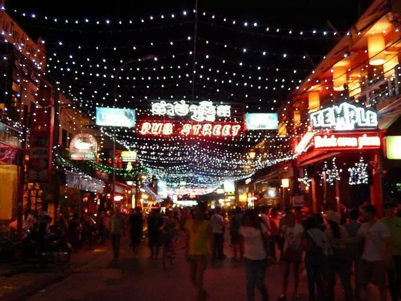 Tourists strolling along Pub Street