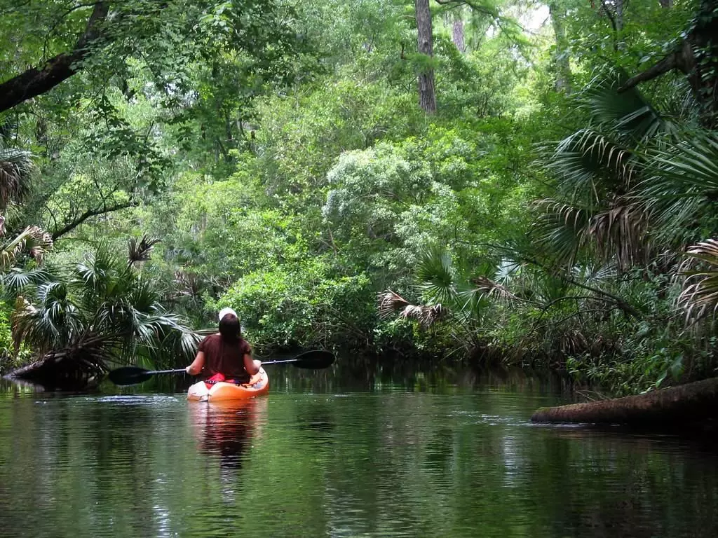 Woman kayaking alone