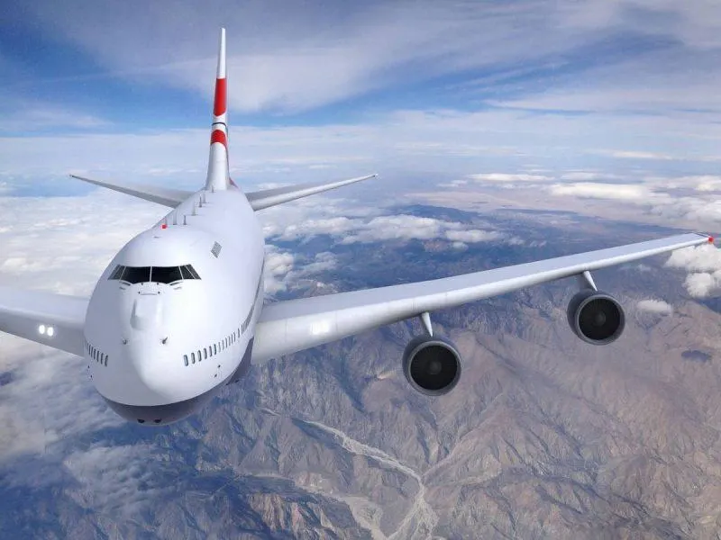 Airplane flying over mountains