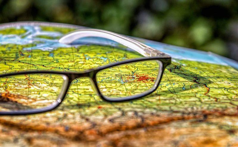 Glasses set on a map