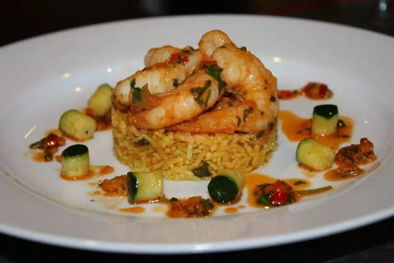 Rice and shrimp arranged on a plate