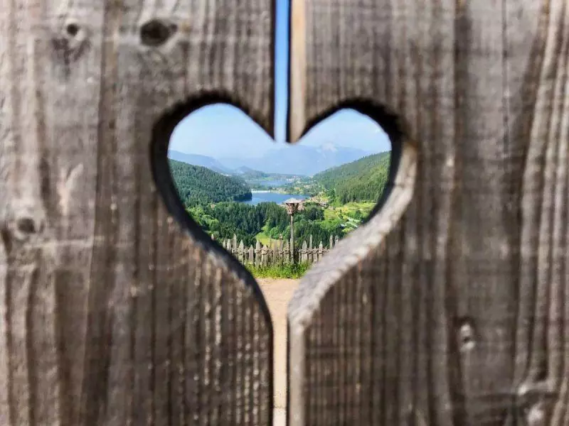 Wooden heart framing a landscape view of the surrounding nature