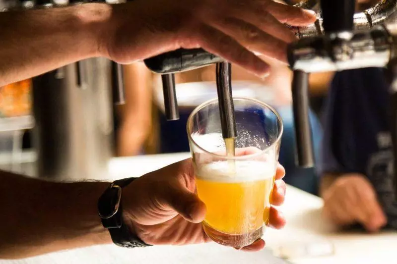 Bartender during beer from a tap