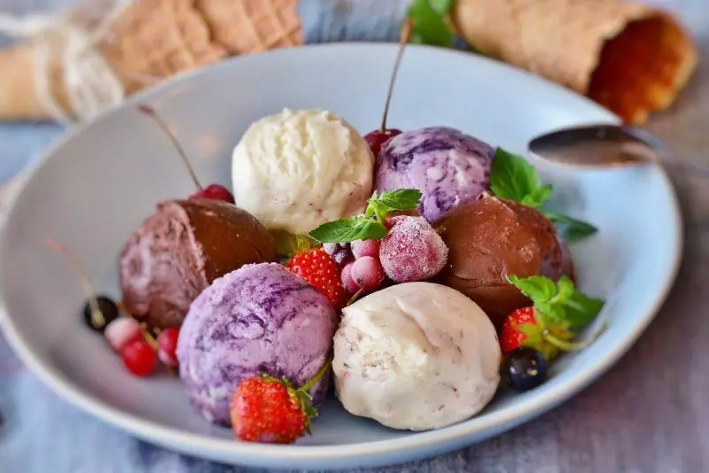 Colorful ice cream with fruit in a bowl