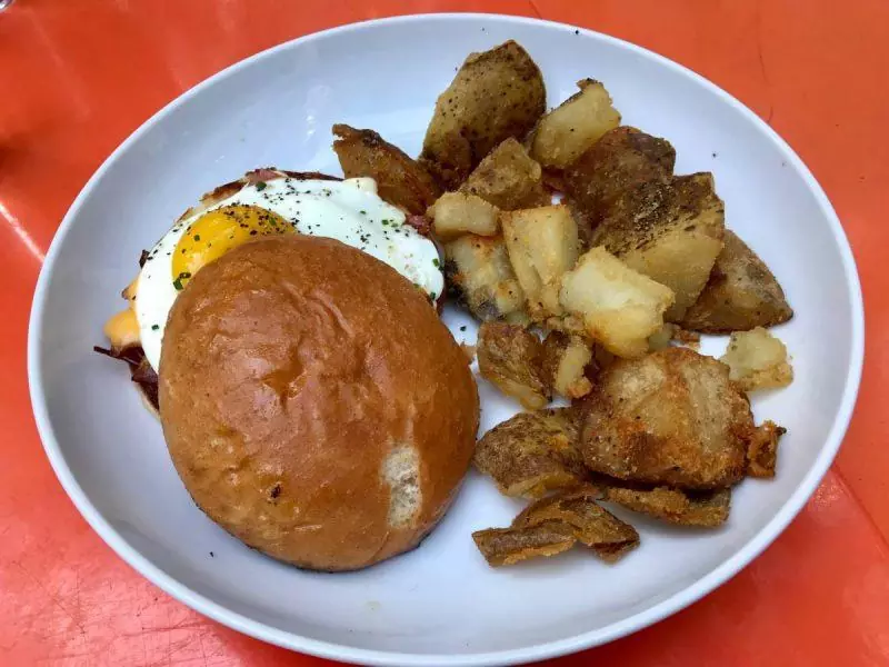 Breakfast sandwich and potatoes