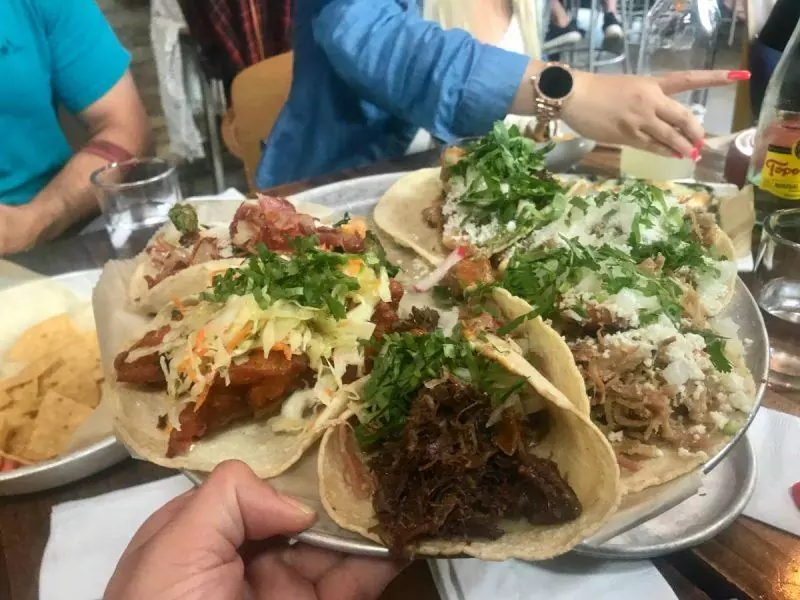 Heaping tacos on a platter