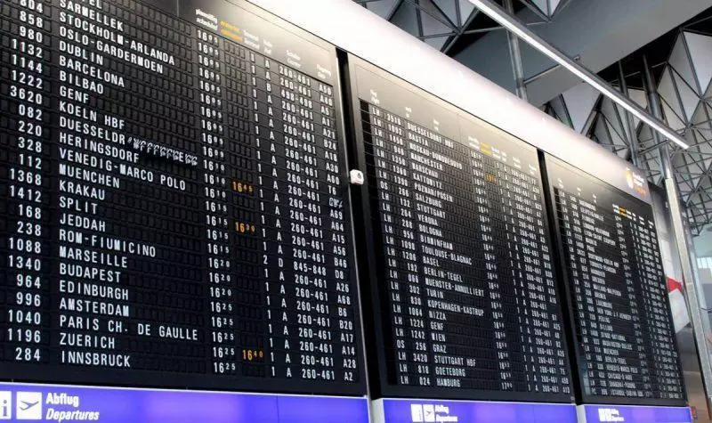 Screens at the airport showing boarding gates