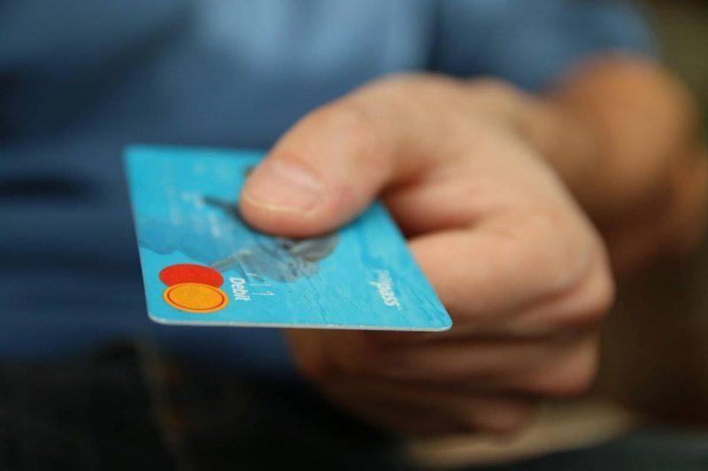 Man handing over a credit card