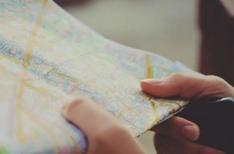 Woman holding a map in hand