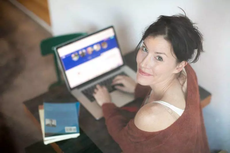 Woman typing on a computer