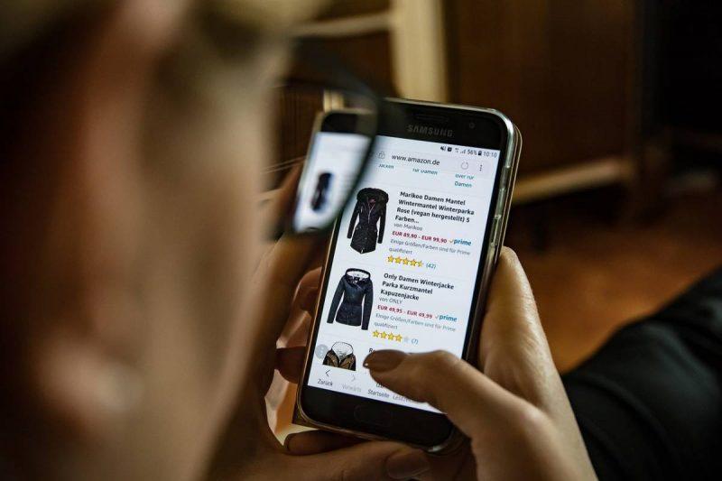 Man shopping on Amazon via mobile device