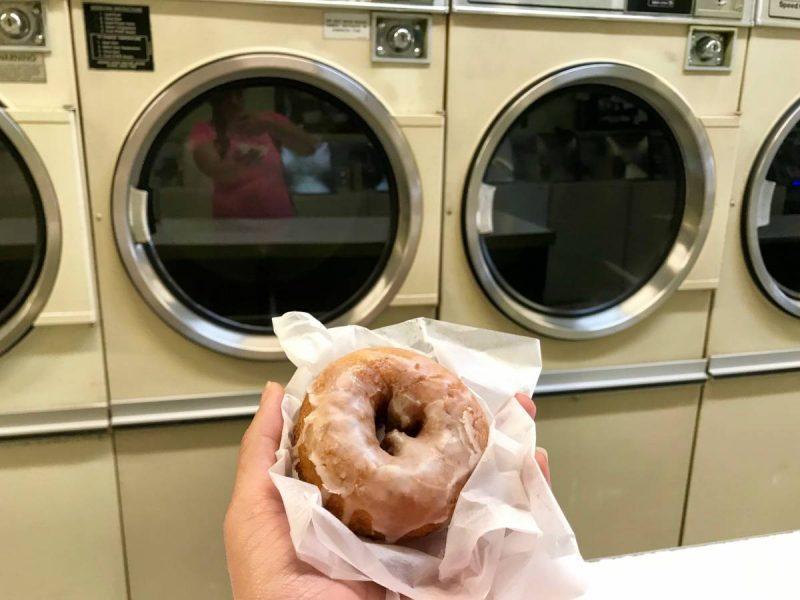 Donut in front of a washing machine 