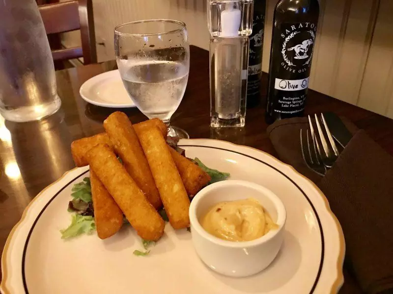 Fried yucca on a plate at dinner