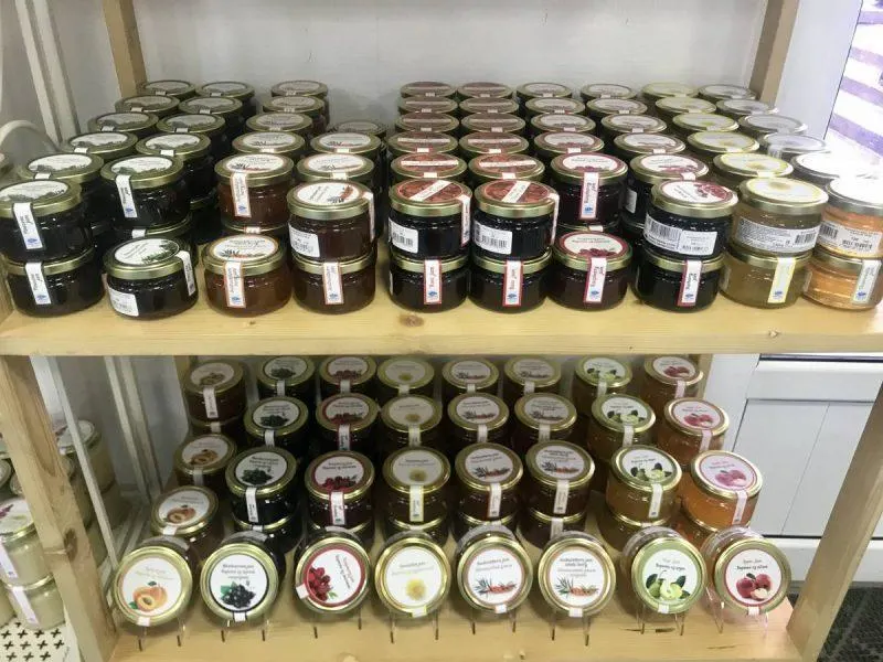 Honey and jam stacked on shelves