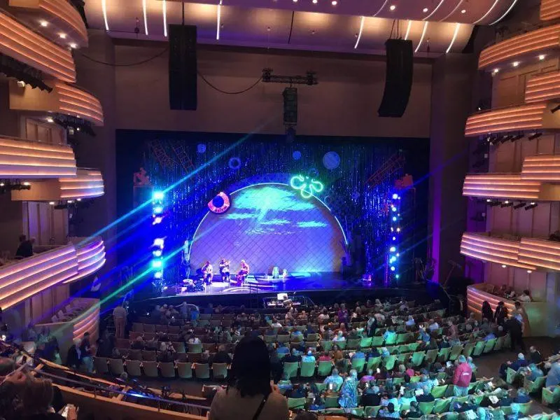 Stage lit up as the crowd files in to the theatre