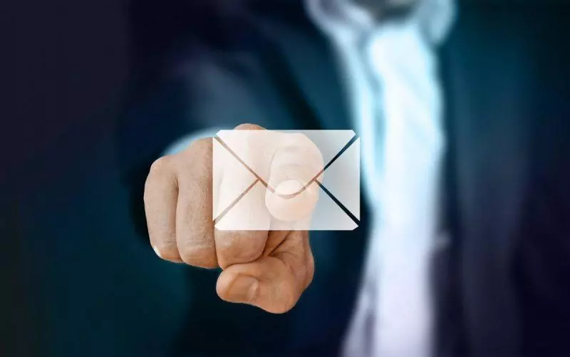 man pushing email icon