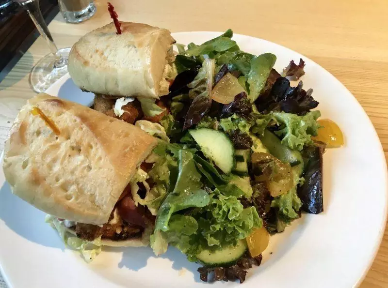 Shrimp po' boy sandwich and salad