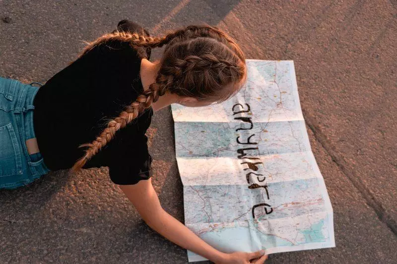 girl reading map