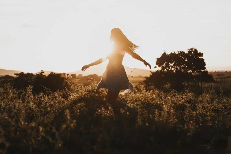 Woman twirling in the sun