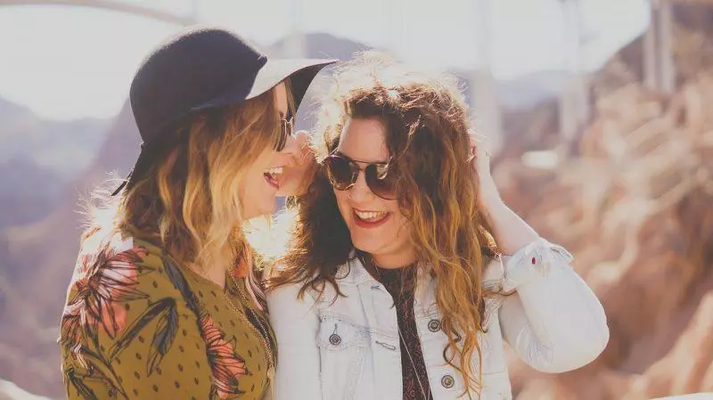 two girls laughing