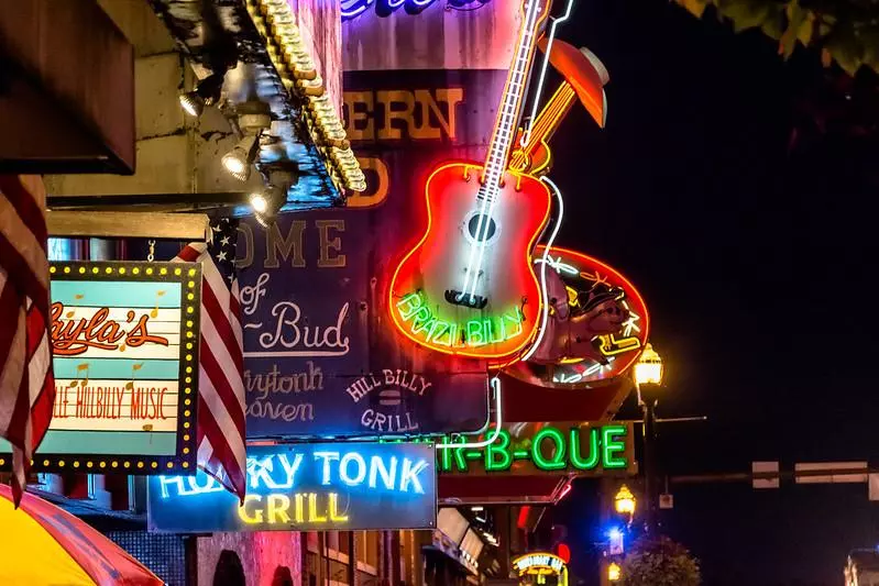 Honky tonk signs lit up at night