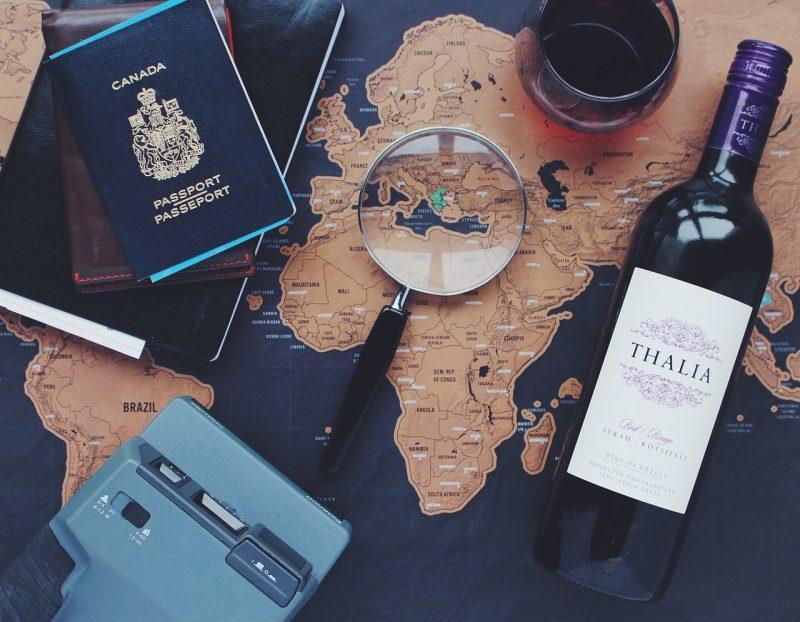 Map, passport and wine