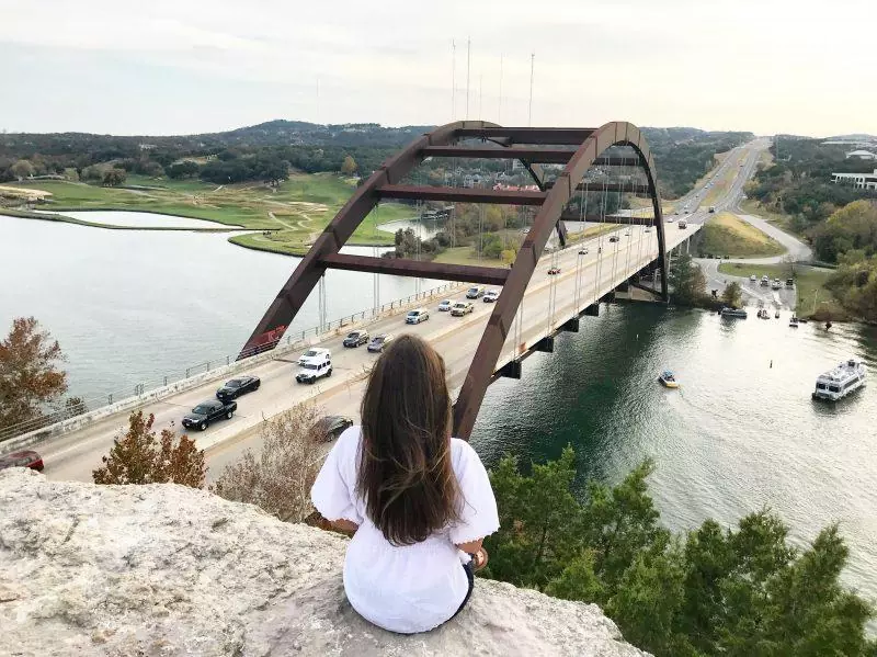 Sitting at the edge of Mount Bonnell