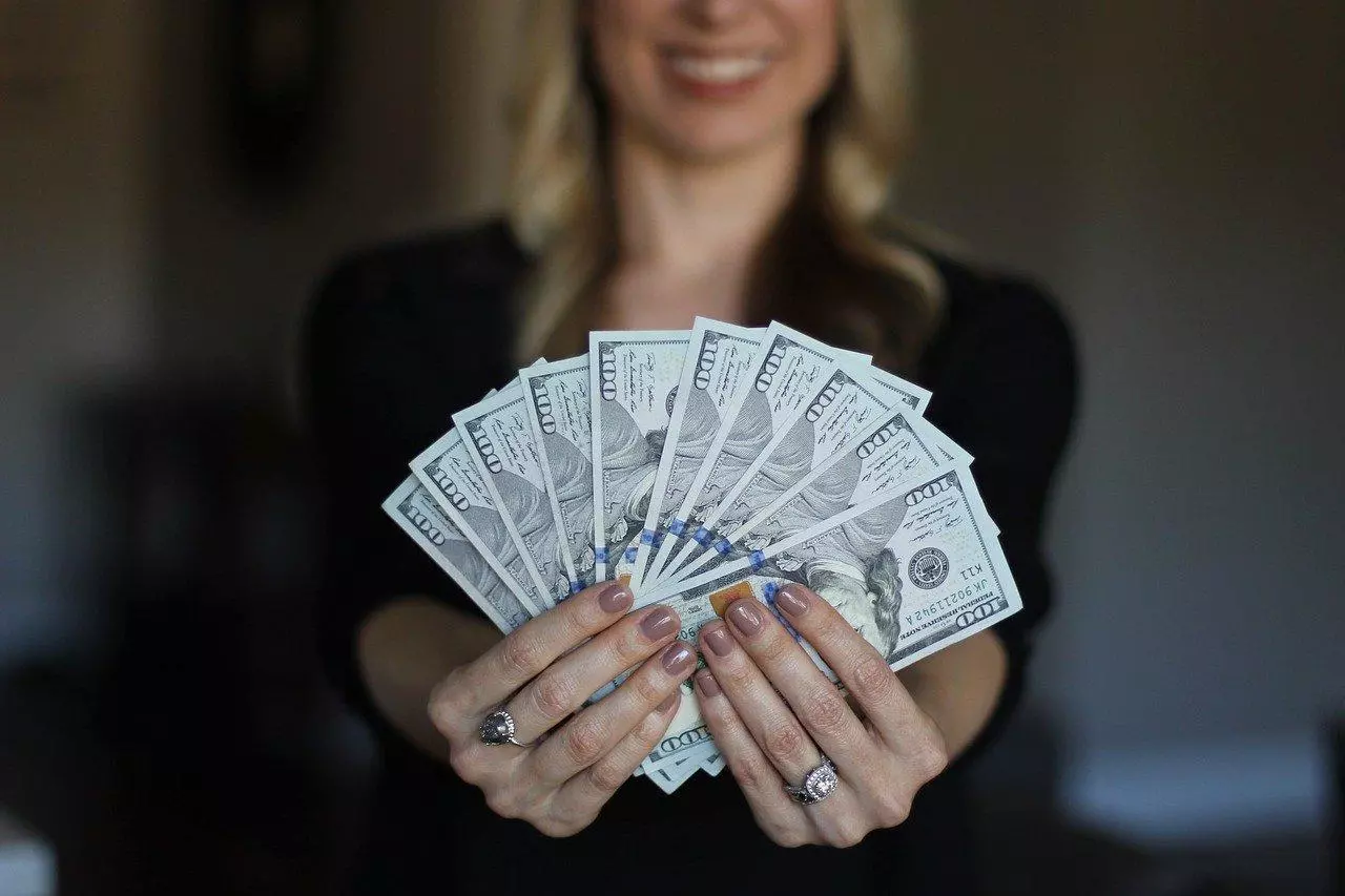 Woman holding cash