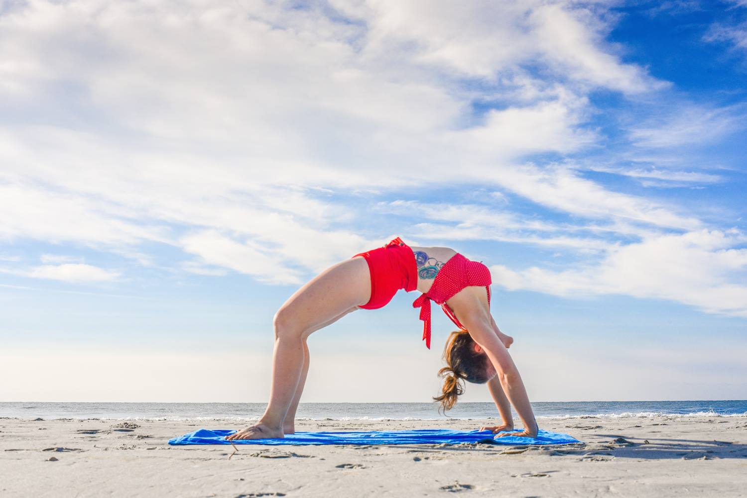 doing yoga on the beach