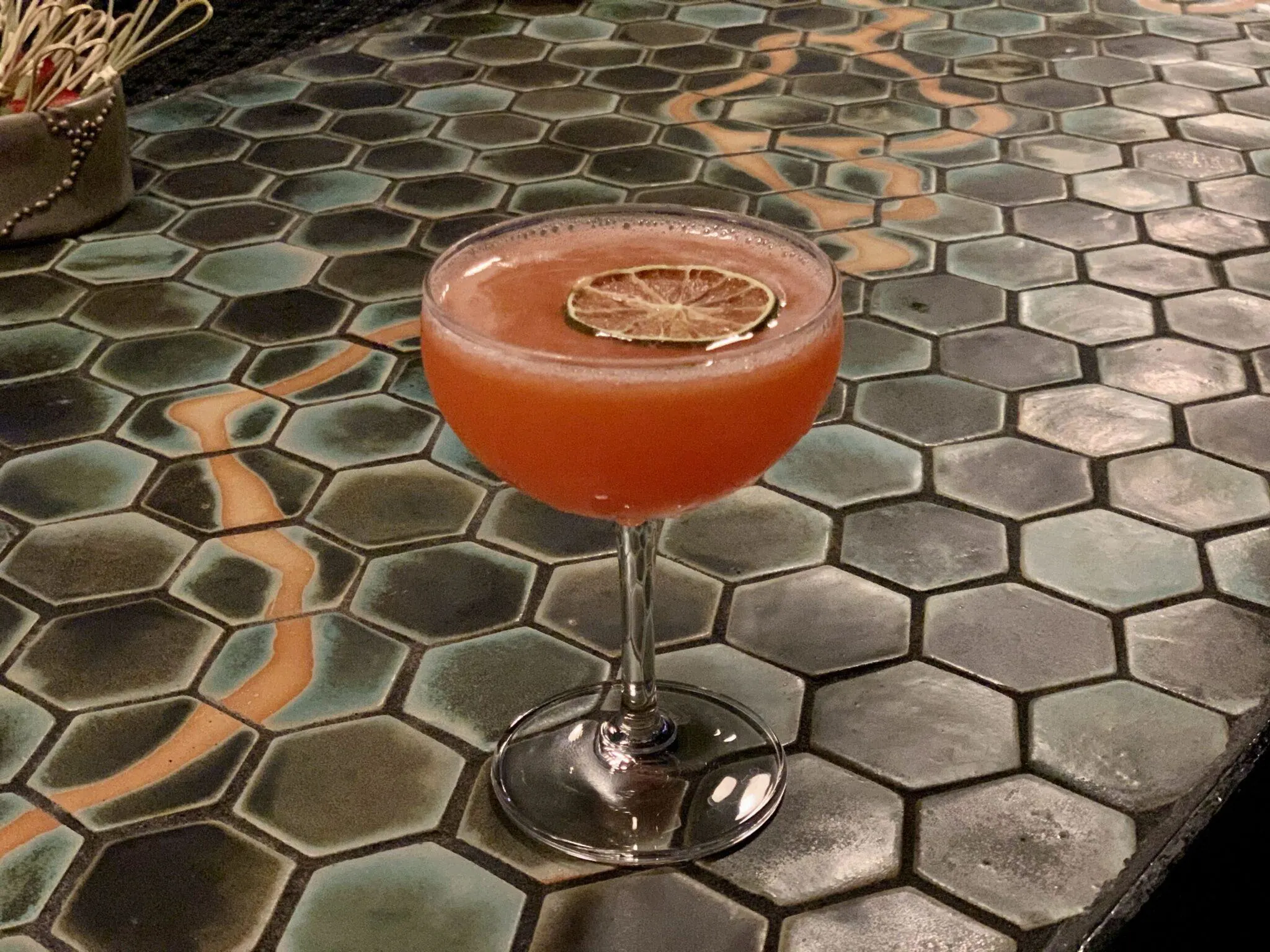 Pink cocktail with line garnish