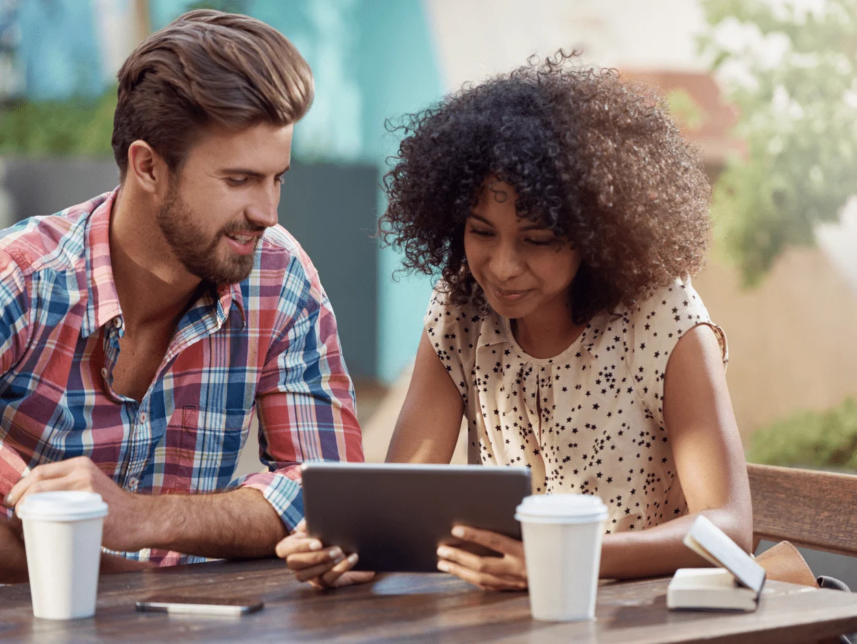 Man and woman looking at tablet