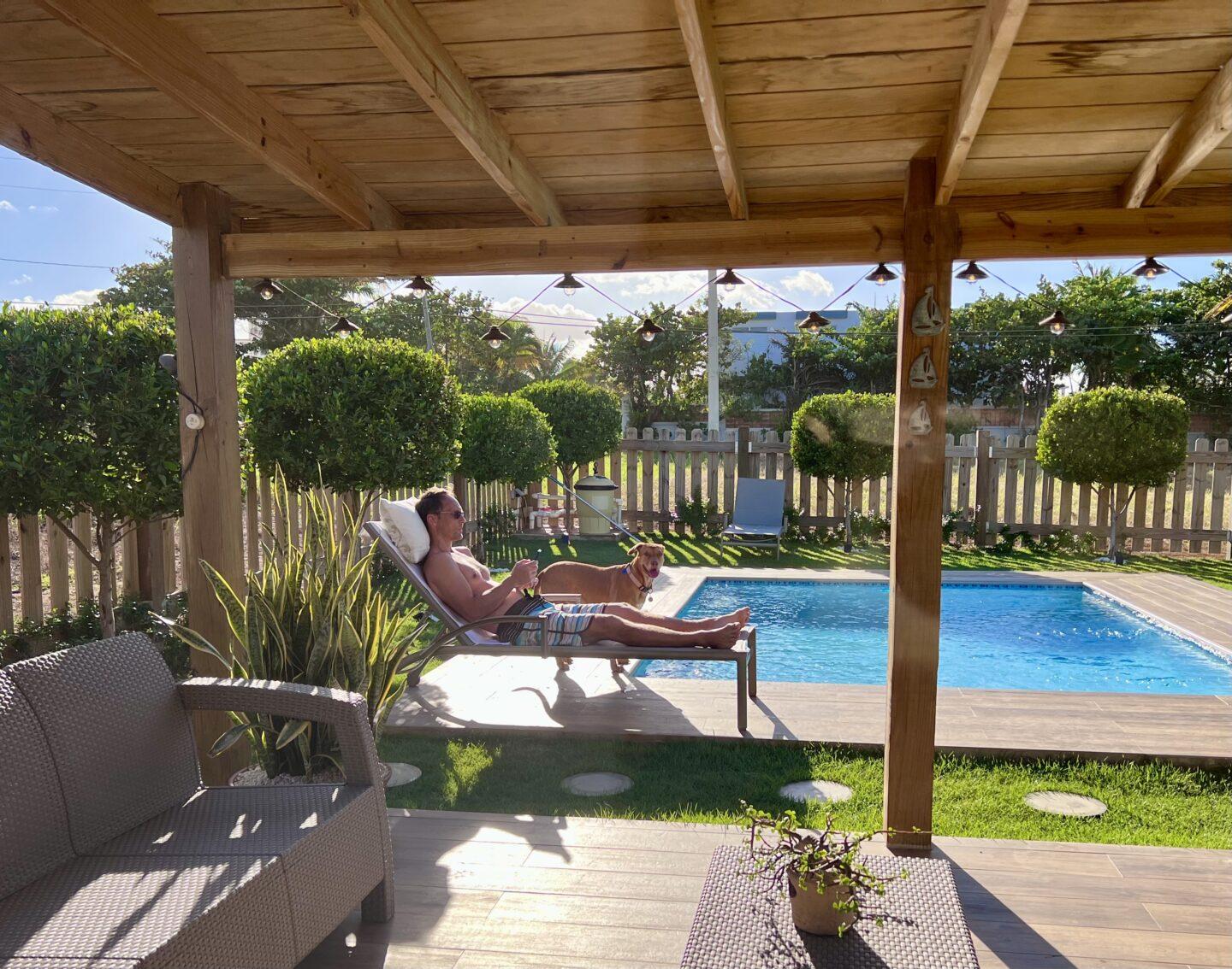 Man lounging by pool