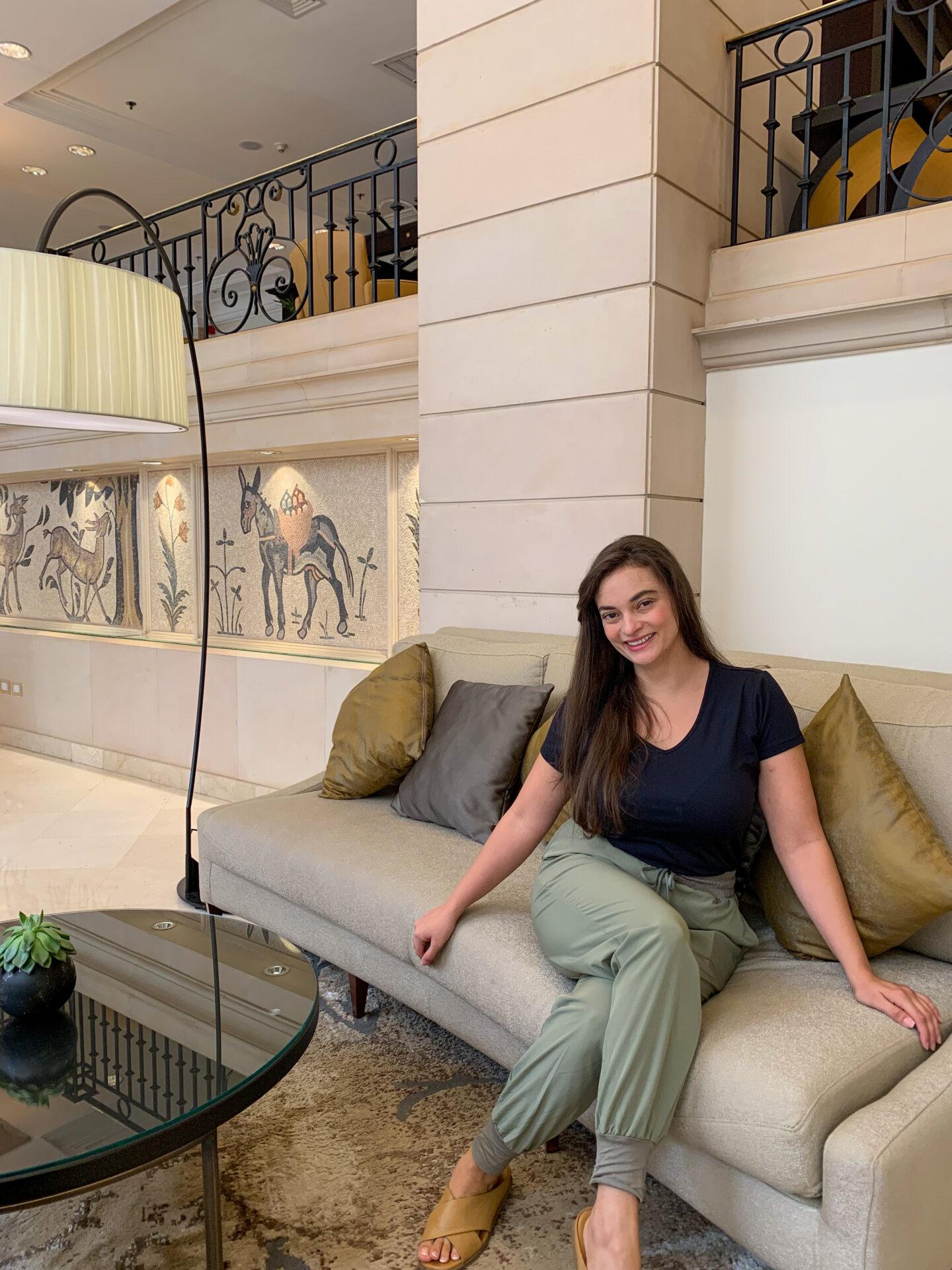 Woman sitting in hotel lobby