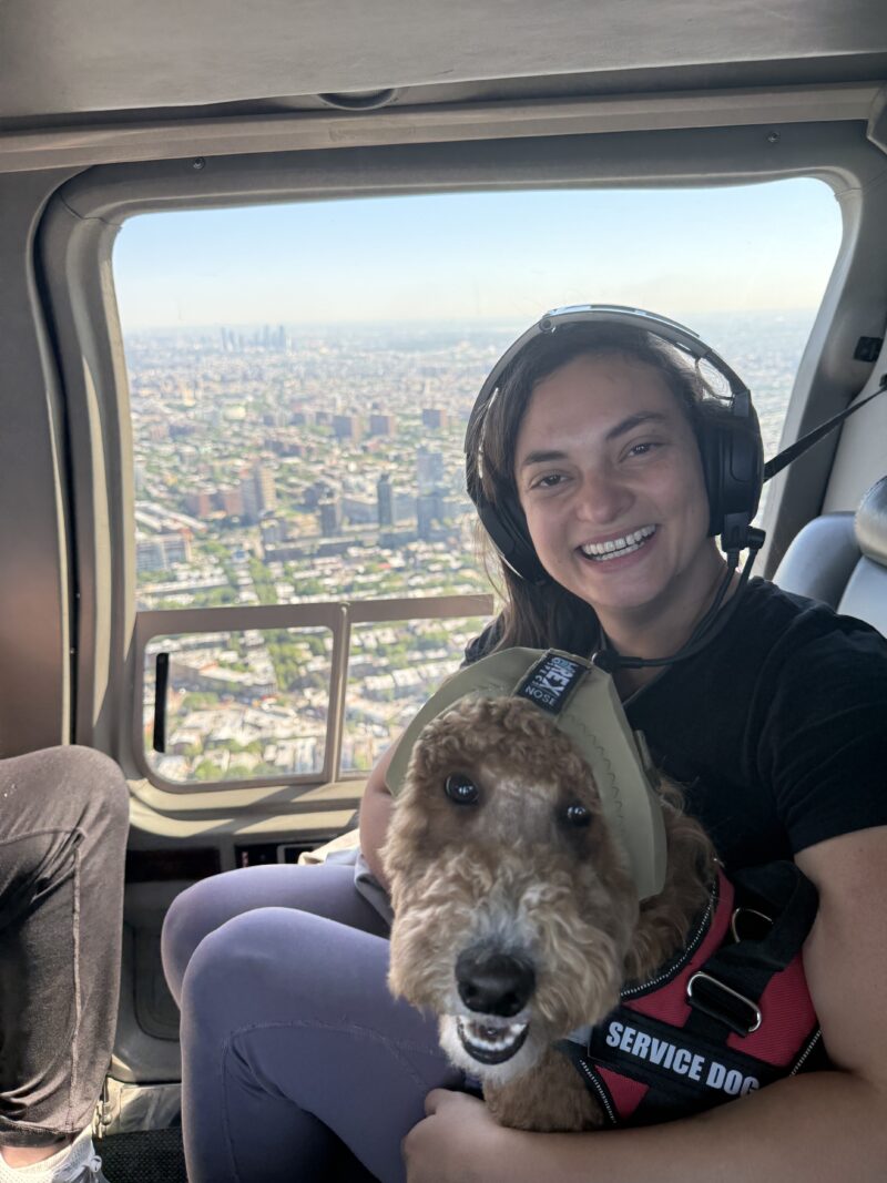 Woman and her dog on a helicopter flight