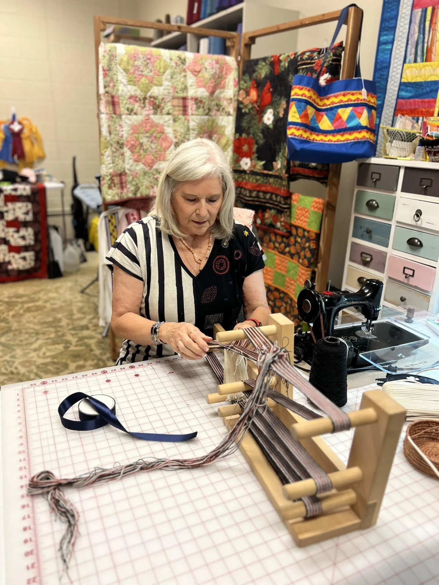 Woman working at her sewing table