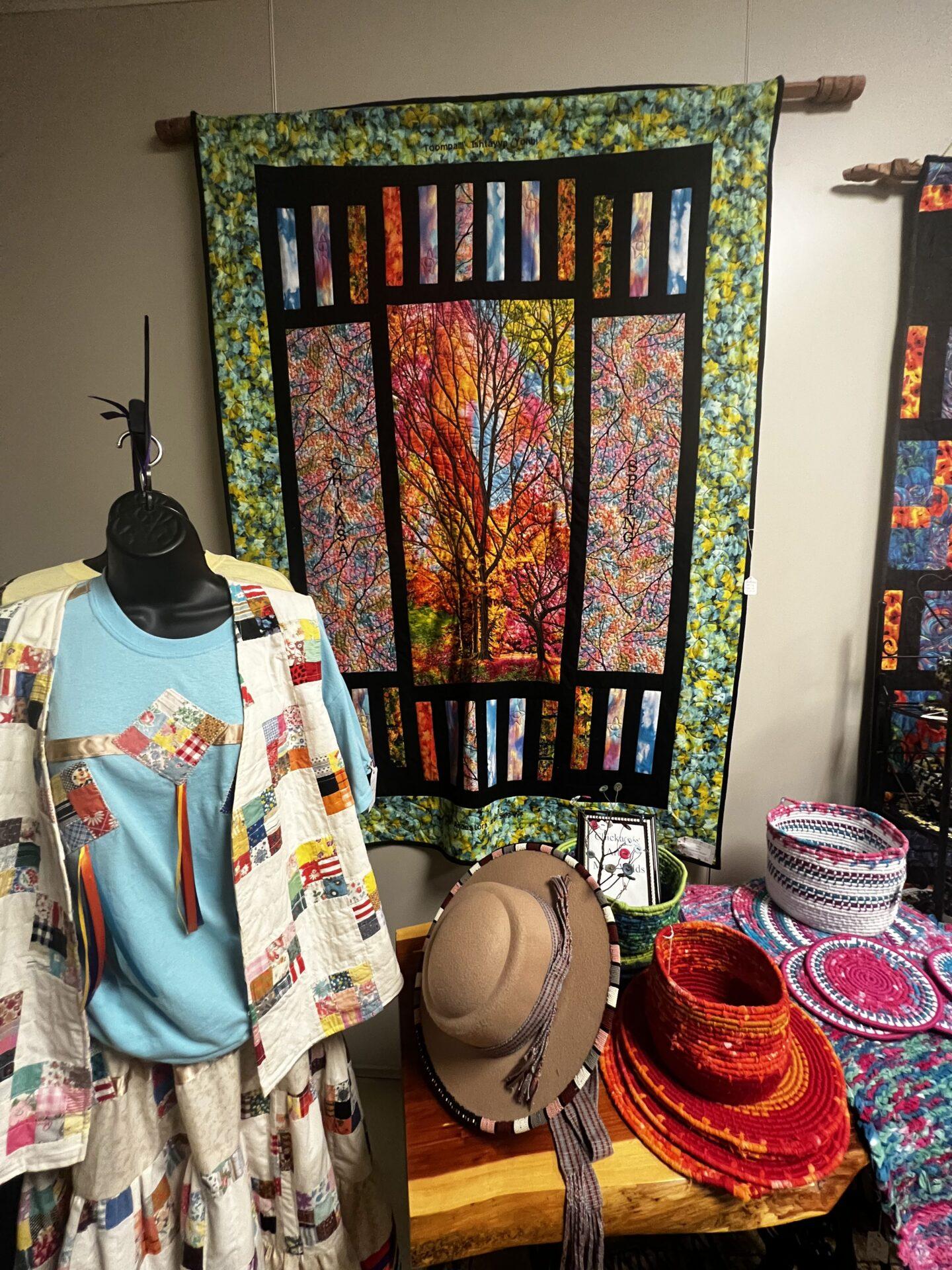 Hanging quilt and art on display