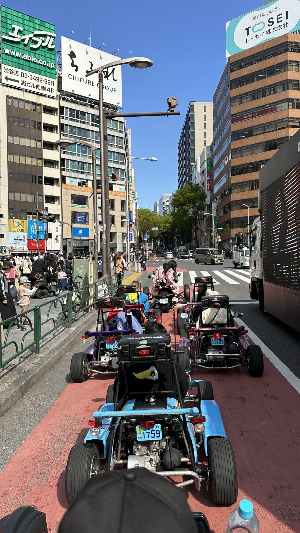 Go-karts stopped at streetlight