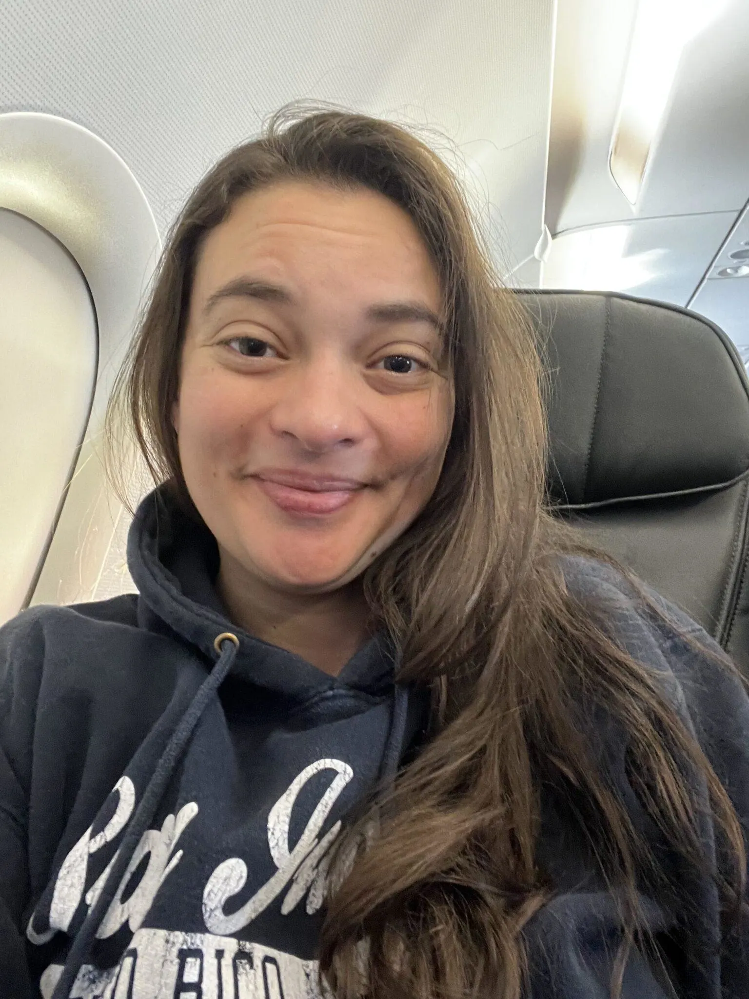 Woman seated on airplane