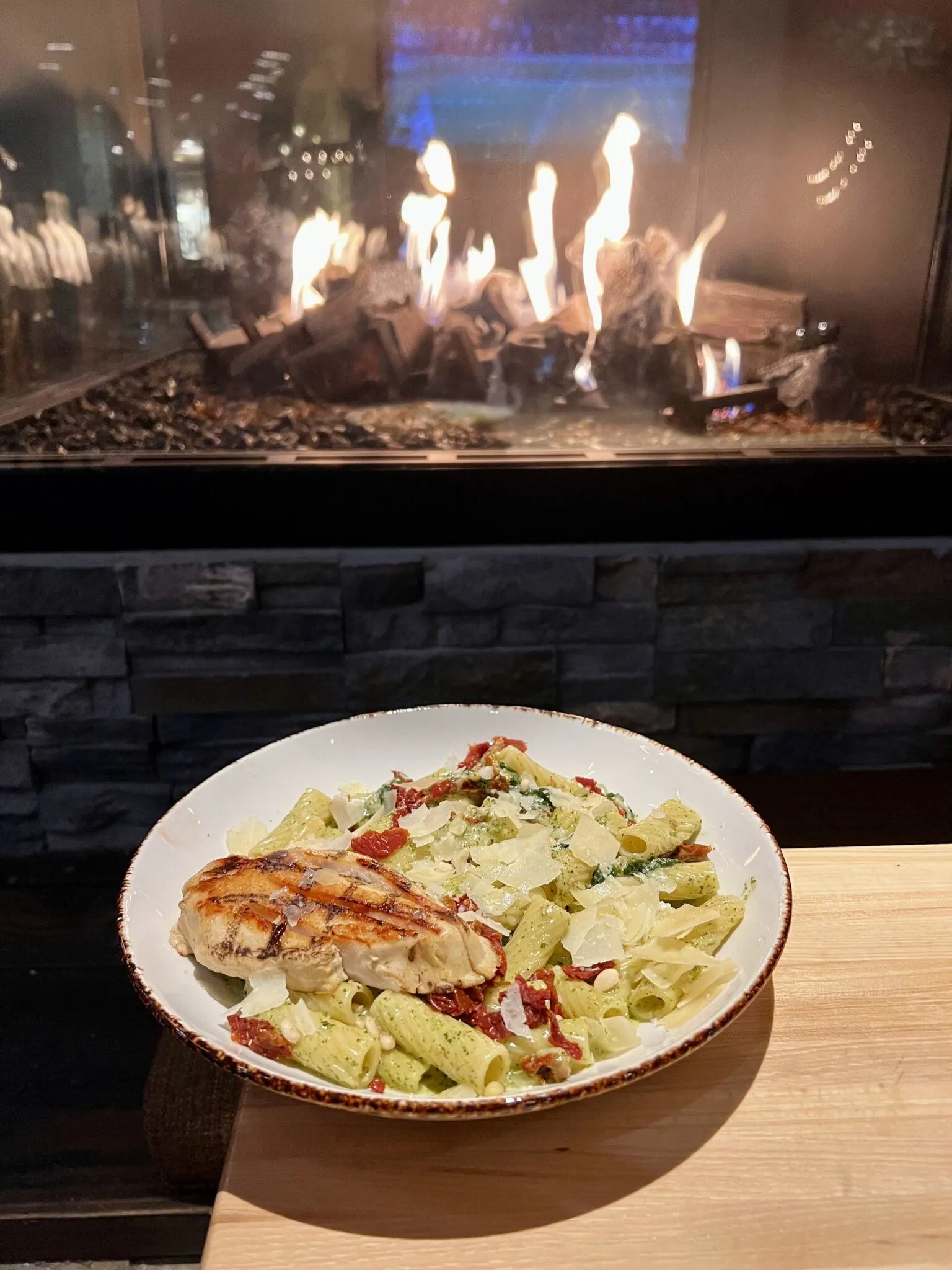 Pasta dish in front of fireplace
