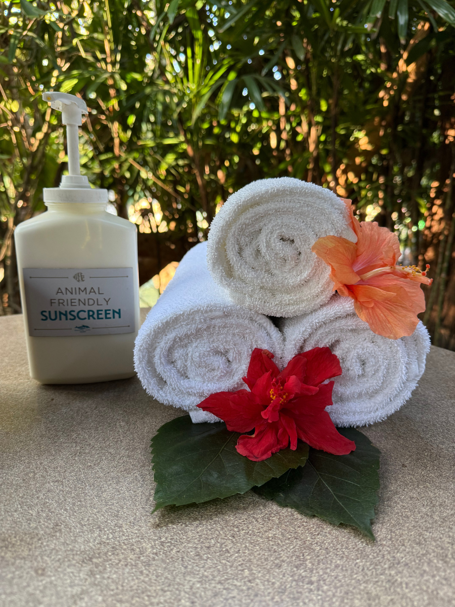 Sunscreen and towels with decorative flowers