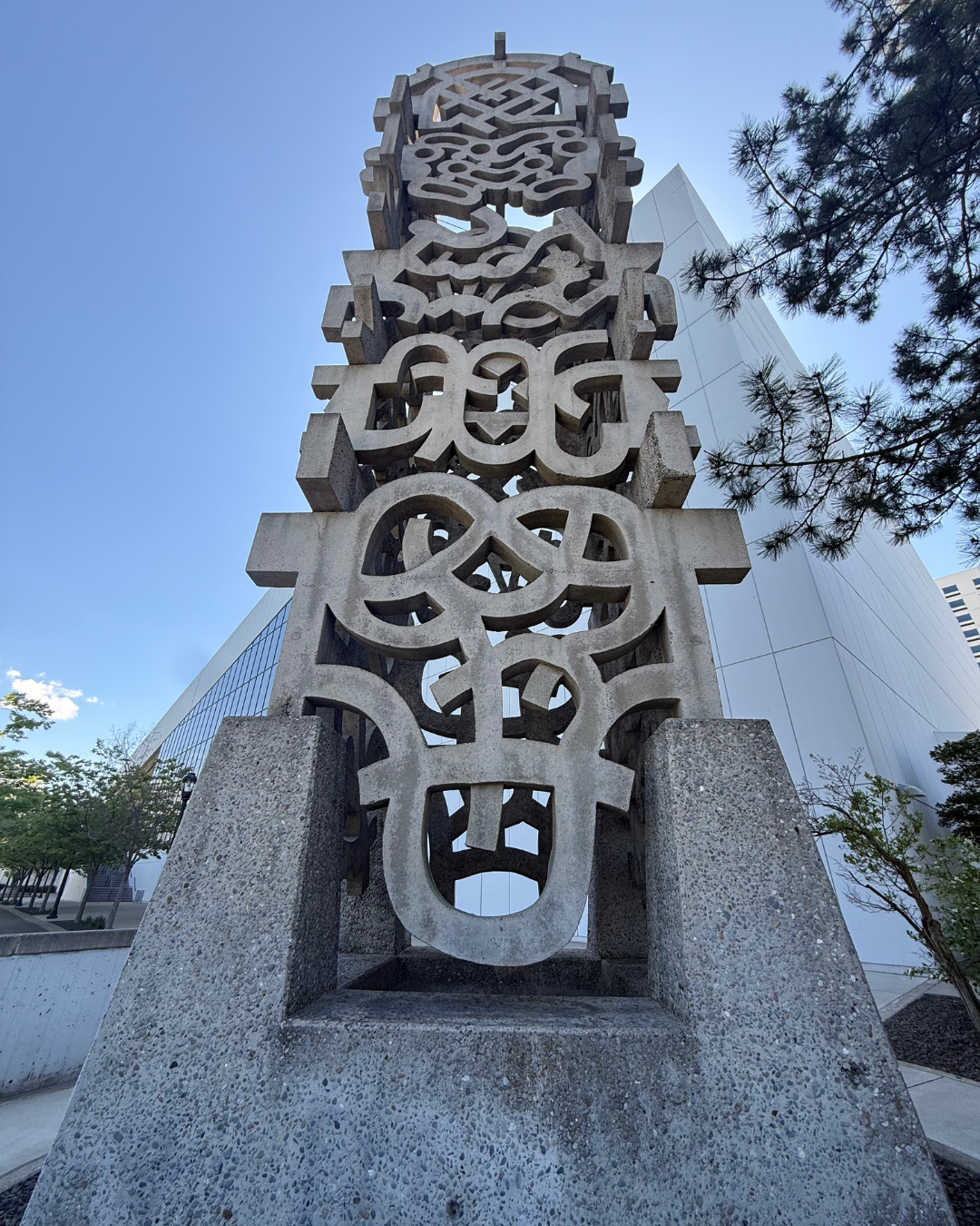 Tall cement sculpture and artwork